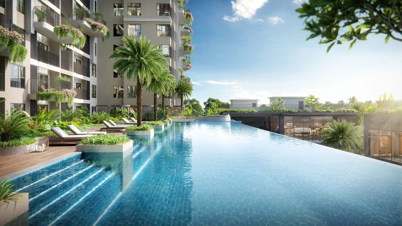 Bể bơi vô cực dưới chân tháp, hàng cọ và ghế tắm nắng